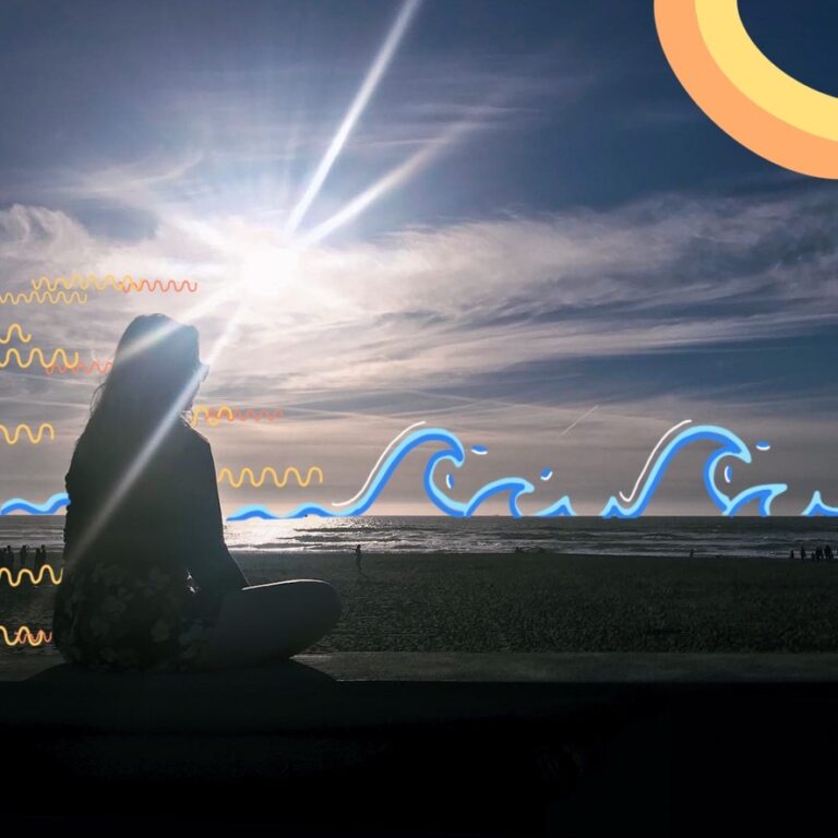 Wendy on a beach, meditating and enjoying the sun