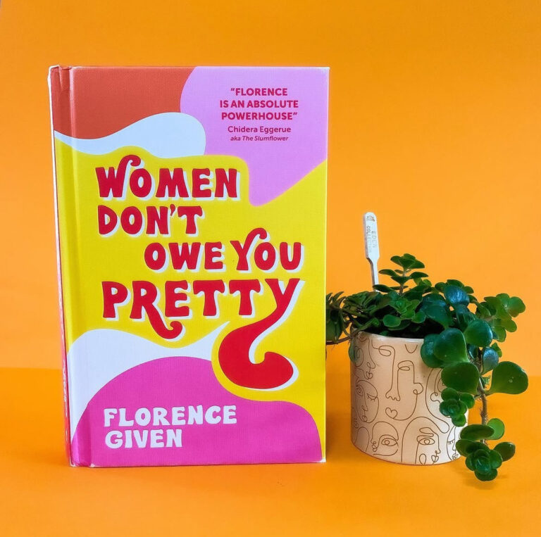 A photo of the book "women don't owe you pretty" by Florence Given in front of an orange backdrop